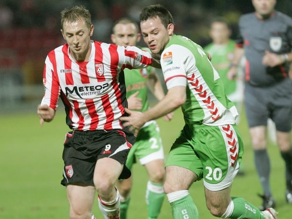 Goalscorer Timmy Kiely is challenged by Derry's Sammy Morrow