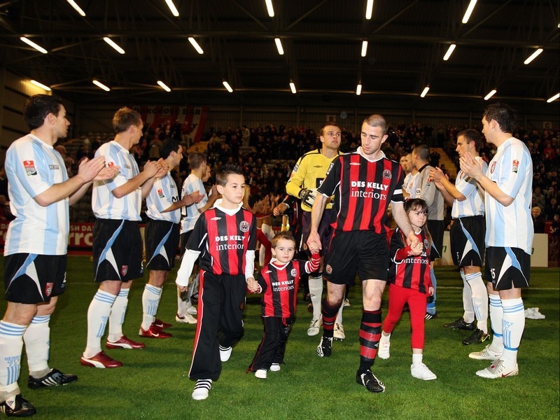 Bohemians' captain Owen Heary leads out his team as the Derry City players form a guard of honor