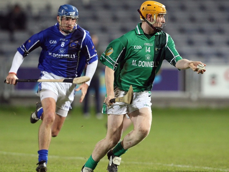 Munster's Tom Kenny and Richie Power of Leinster in action in Portlaoise this evening