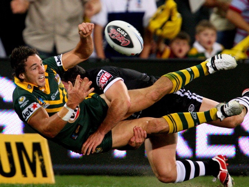 Billy Slater offloads acrobatically during the recent World Cup