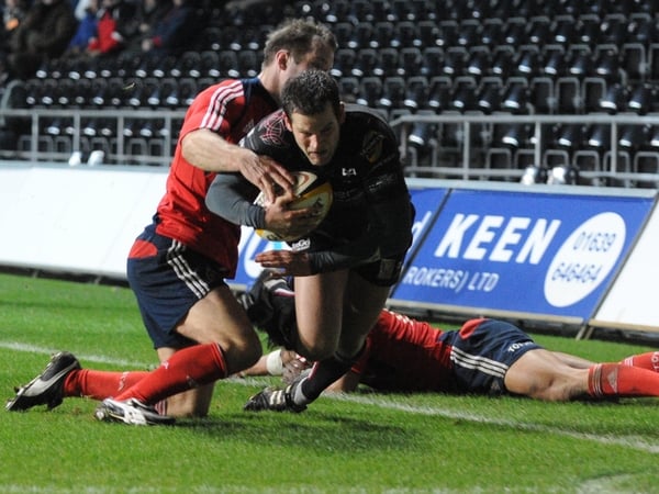 Tomas O'Leary makes a try saving tackle on Ospreys' Jonny Vaughton
