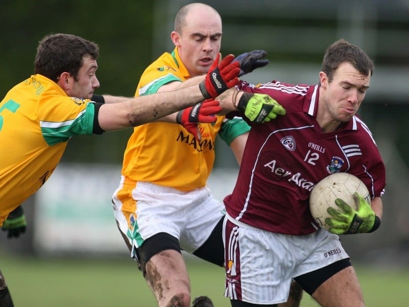 Galway's Cormac Bane tackled by James Glancy and declan Maxwell of Leitrim