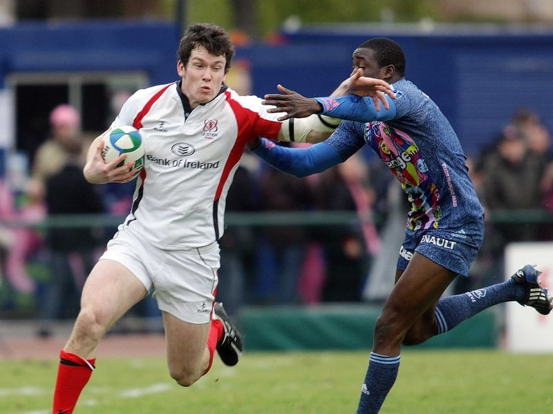 Ulster's Ian Whitten attempts to out-flank Stade Francais' Djibril Camara
