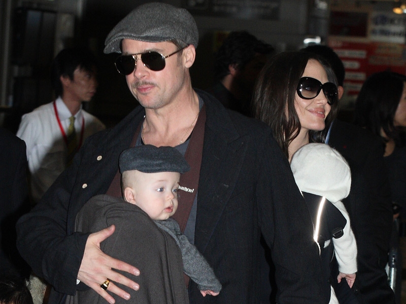 Pitt and Jolie with their twin babies Knox and Vivienne