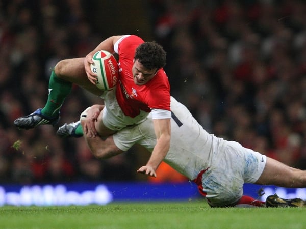 Jamie Roberts of Wales is tackled by England's Joe Worsley