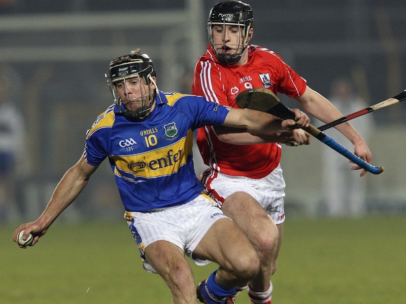 James Woodlock of Tipperary is tackled by Cork's Glen O'Connor