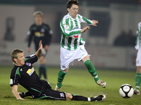 Galway United's Sean Kelly tackles Paddy Kavanagh Bray Wanderers