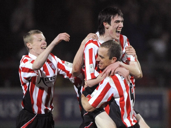 Derry players celebrate the winning goal