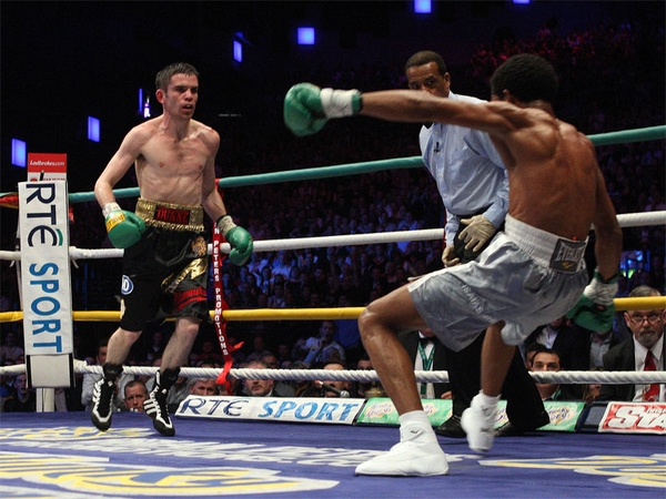 Bernard Dunne knocked the champion down three times in the eleventh round before the referee called a halt to the fight one second before the bell