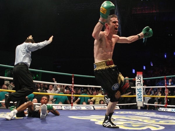 Bernard Dunne wheels away in delight after dropping Ricardo Cordoba for the final time