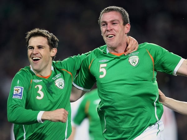 Kevin Kilbane celebrates with Richard Dunne after the captain's first-minute opening goal