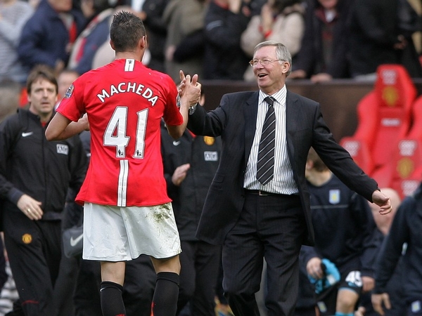 Federico Macheda is congratulated by manager Alex Ferguson after scoring the winning goal against Villa