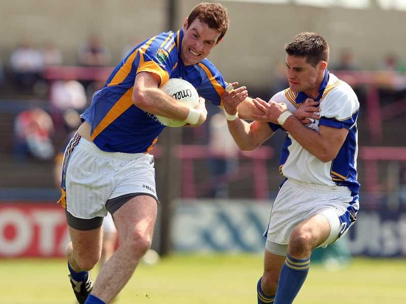 Longford's Shane Mulligan and Thomas Walsh of Wicklow battle for possession in Portlaoise