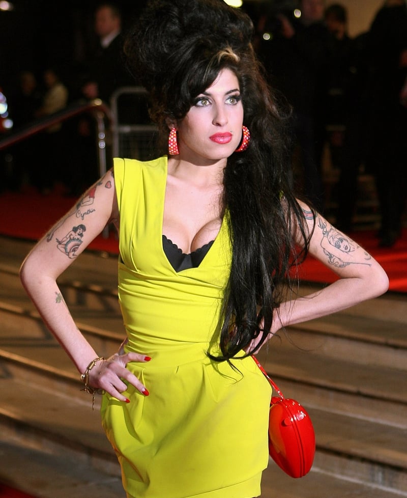 Amy Winehouse in one of her most famous looks, attending the Brit Awards