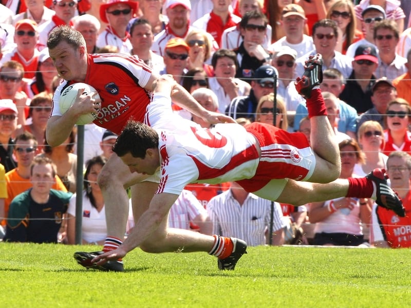 Armagh's Ronan Clarke battles with Tyrone's Conor Gormley in Clones