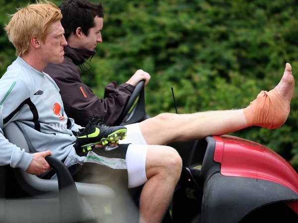 Paul McShane is carted off after picking up a knock during training yesterday