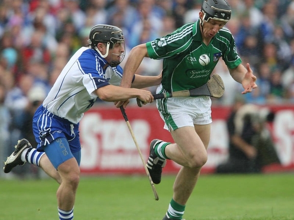Limerick's Ollie Moran races clear of Waterford's Noel Connors