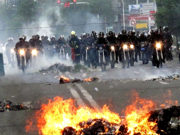 Tehran - Police on motorcycles clash with protestors