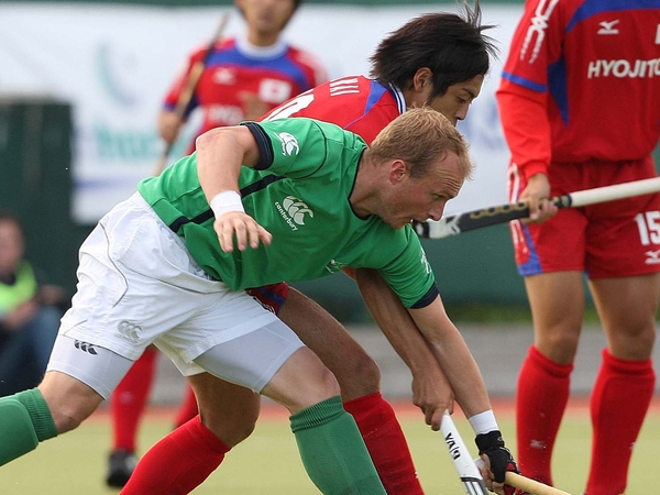 Graham Shaw and Anai Yoshihiro compete for the ball