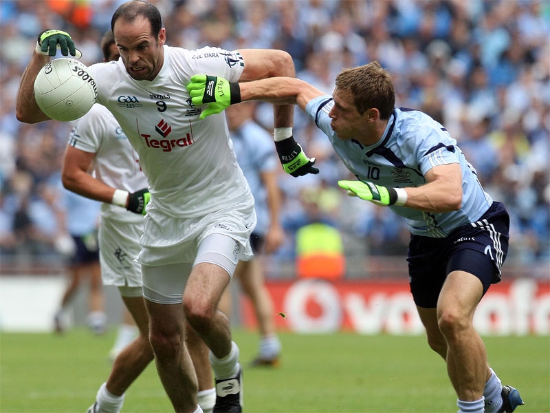 Kildare's Dermot Earley tussles with Paul Flynn of Dublin