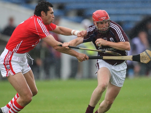 Cork's Sean og o hAilpin and Niall healy of Galway tussle for possession