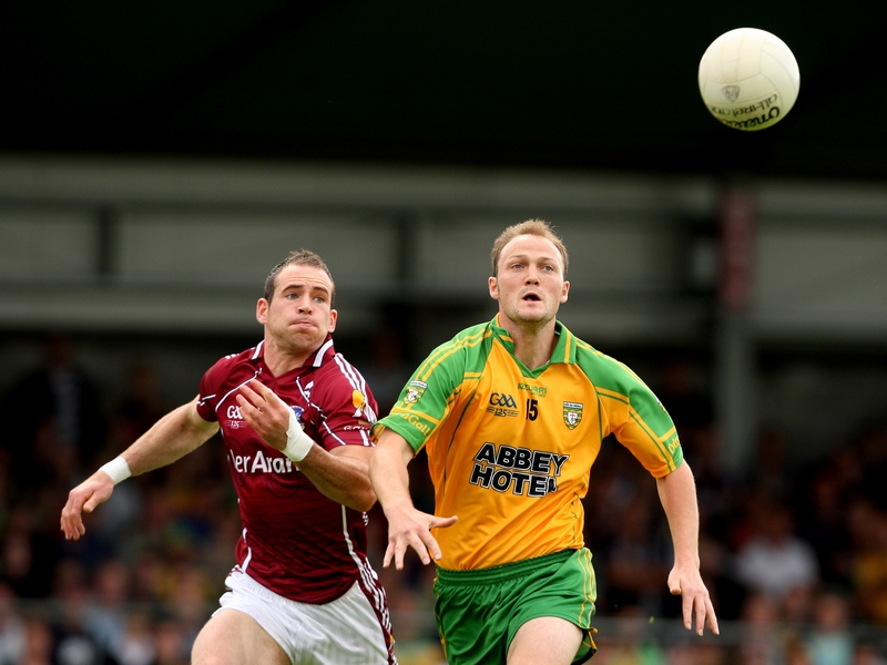 Donegal's Colm McFadden and Galway's Damien Burke battle for possession at Markievicz Park