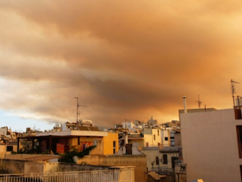 Athens - Smoke visible across city skyline