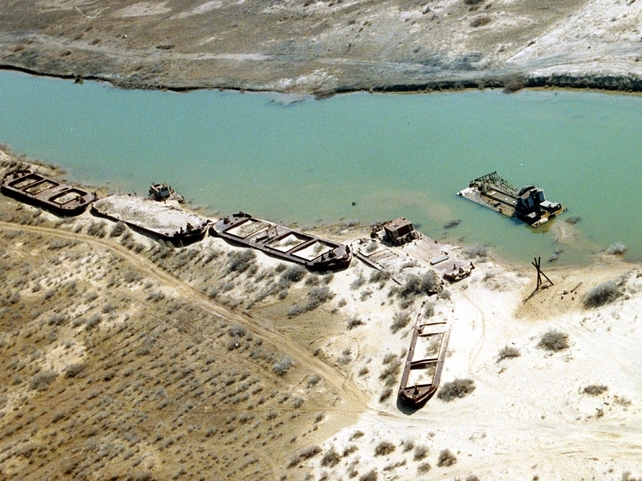 The receding sea has left plains covered with salt and toxic chemicals