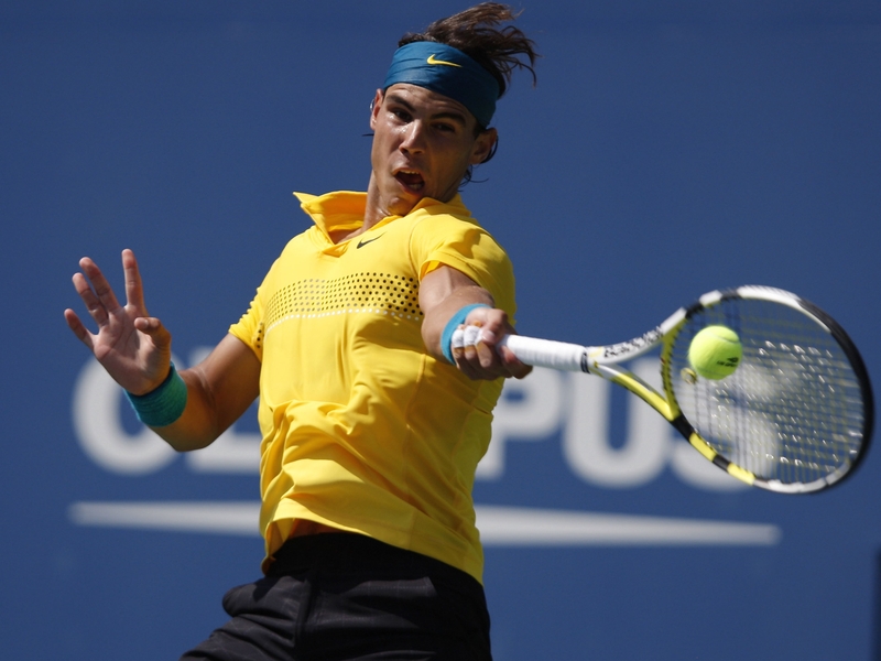 Rafael Nadal stuttered into the last four after Ivan Ljubicic was forced to retire through injury