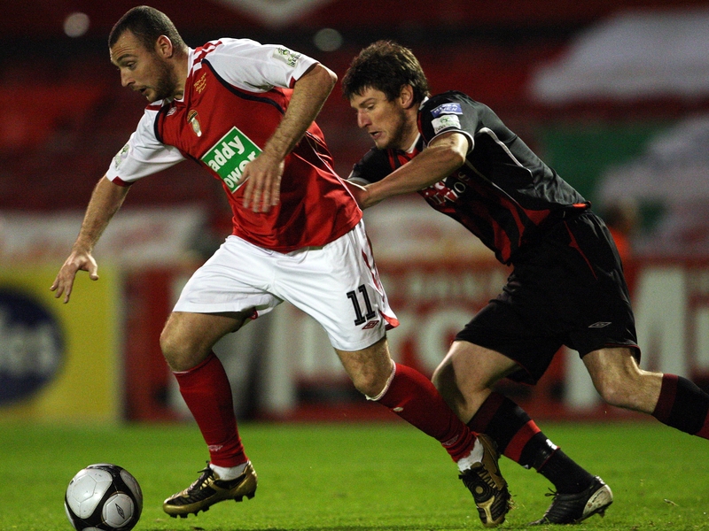 St Pat's Mark Quigley is chased down by Boh's Ken Oman