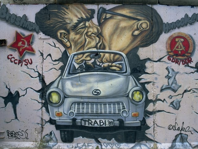 Graffiti depicting a kiss between East German leader Erich Honecker and his Soviet counterpart Leonid Brezhnev