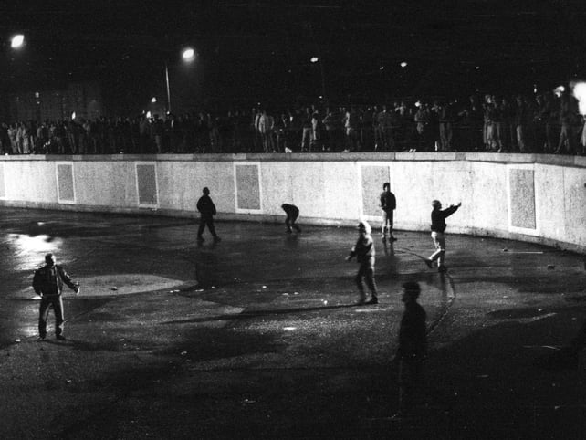 People standing on top of the Berlin Wall 9 Nov 1989