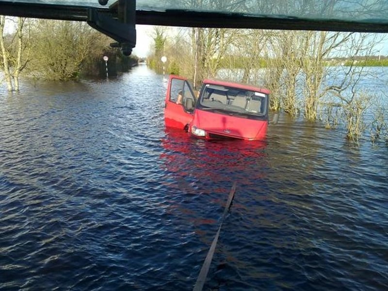 A van gets assistance in the floods on Station Road, Ballinasloe - (Credit: Miriam Hurley)