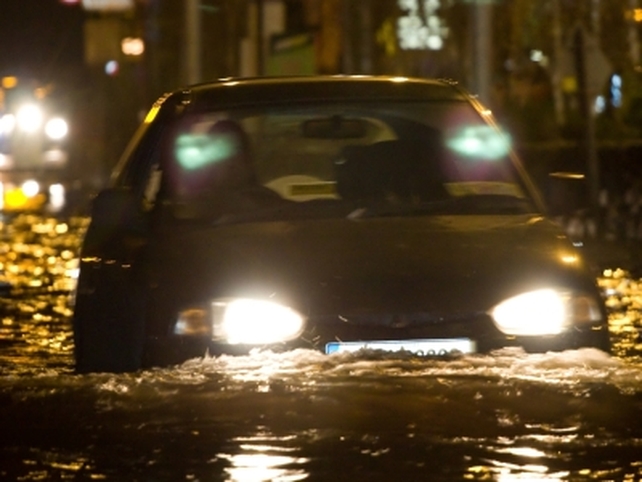 Cars struggle through flooded streets in Claregalway - (Credit: Cian Gallagher)