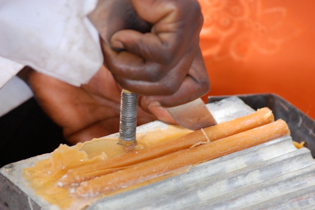 The candles are then cut out of the mould and are sold along with the honey in a small shop in the centre