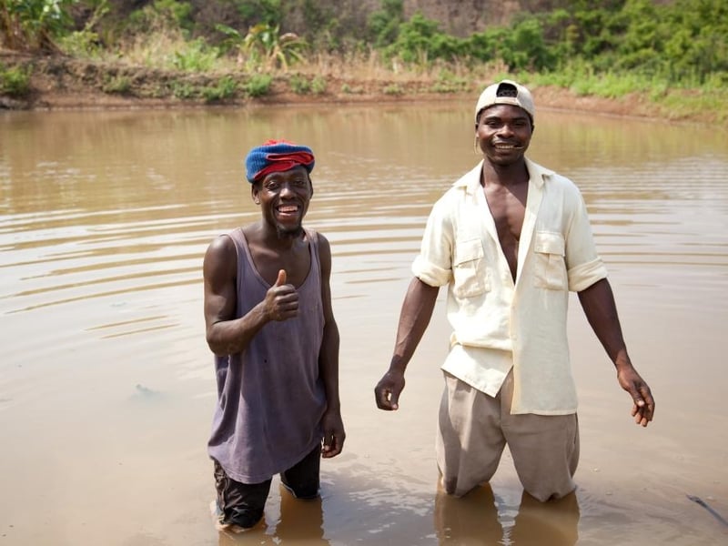 The Unwrapped Fish Pond Gift provides food, income and more to entire villages in Africa. Pictured are Kandulu Tembo (left) &amp; Willie Yasin from the Mambiri Club, a part of Chisangalalo Community Based Organsiation.