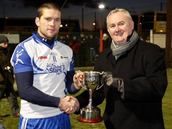 Dublin Stars captain Conal Keaney receives the Evening Herald/Dublin Bus Dubs Stars Football Challenge from GAA President Christy Cooney