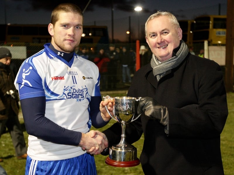 Dublin Stars captain Conal Keaney receives the Evening Herald/Dublin Bus Dubs Stars Football Challenge from GAA President Christy Cooney