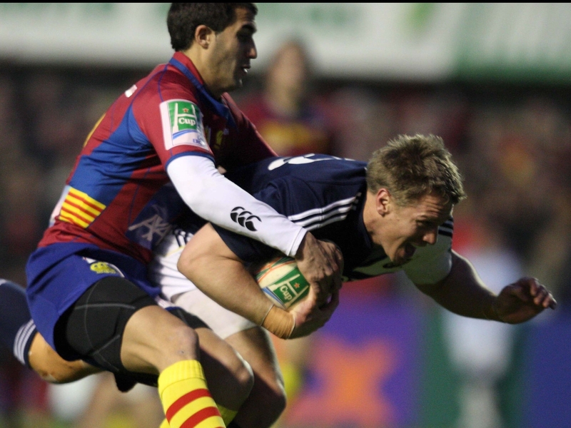 Jean De Villiers drags Maxime Mermoz over the line to score a key try against Perpignan