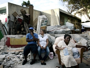 Haitians live on the streets with their belongings in fear of further aftershocks hitting the city