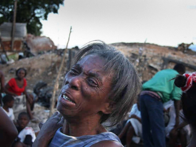 Residents search the rubble in the immediate aftermath of the earthquake