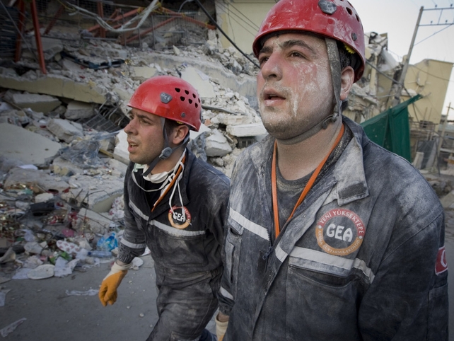 Exhausted rescuers from Turkey return after hours spent searching for survivors