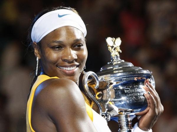 Serena Williams cradles her Australian Open trophy