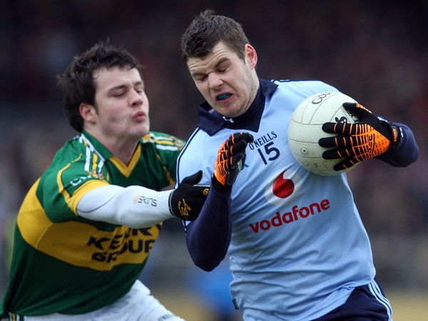 Kerry's Padraig Reidy tussles with Dublin's Kevin McManamon