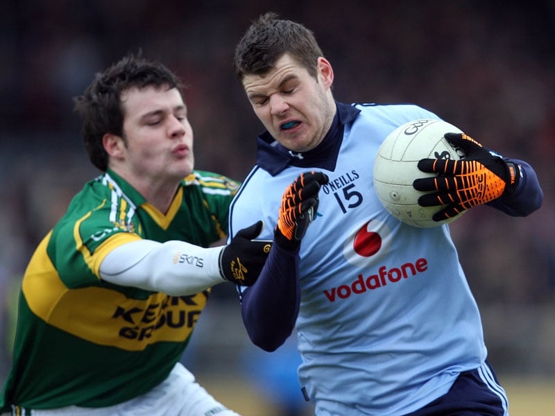 Kerry's Padraig Reidy tussles with Dublin's Kevin McManamon