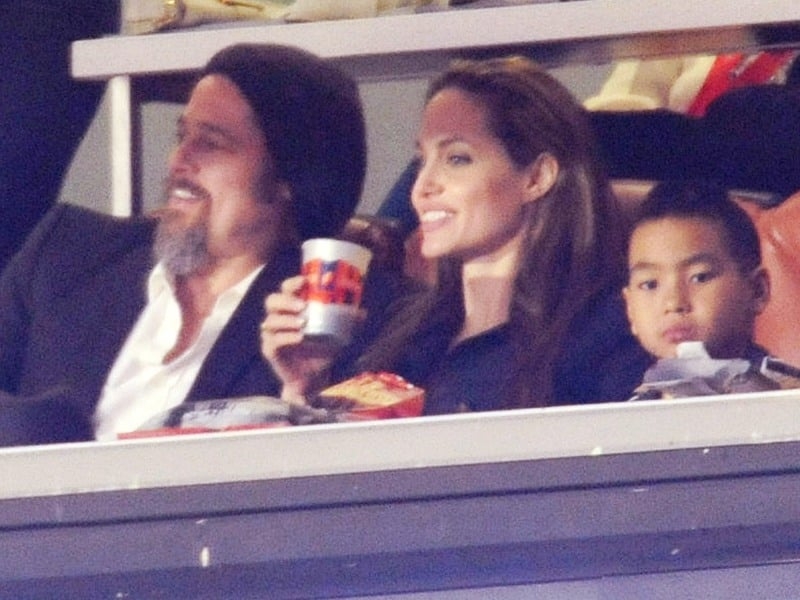 Brad Pitt, Angelina Jolie and their son, Maddox, at the Super Bowl