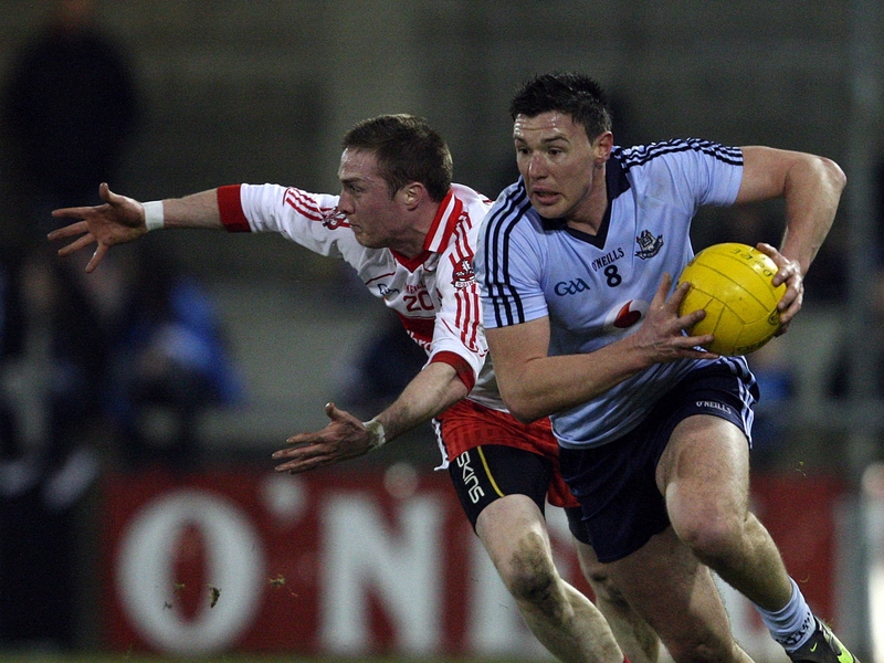 Dublin's Eamonn Fennell evades Derry's Joe Diver