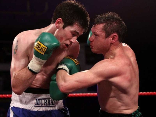 Andy Murray (left) in action against Oisin Fagan