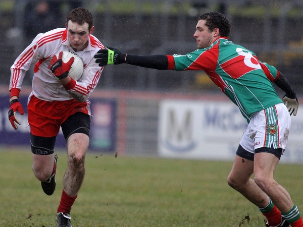 Tyrone's Aidan Cassidy and Mayo's Tom Parsons