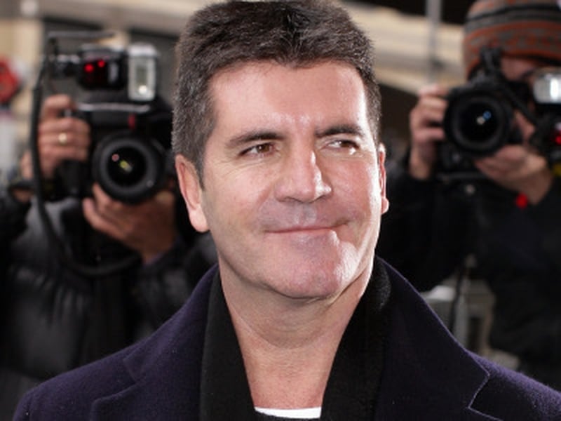 Cowell - Says that he gets on "fine" with Ellen DeGeneres